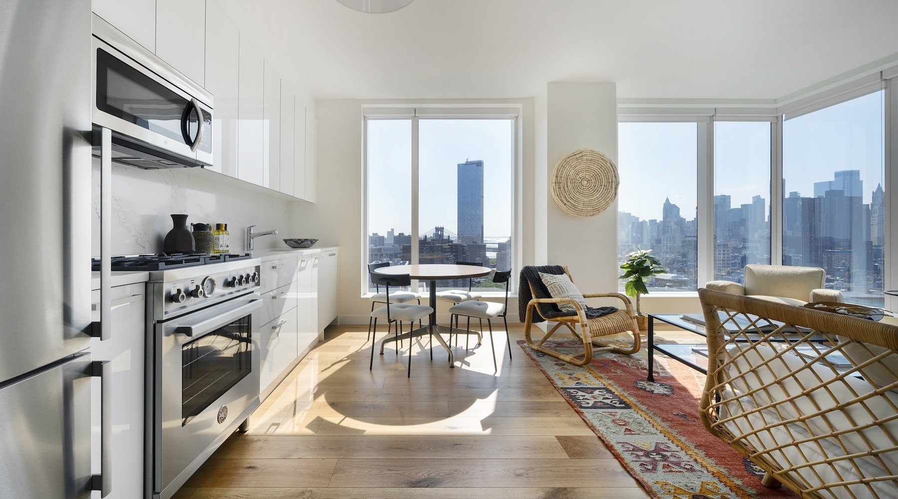 The Art of Living Now Leasing living room with a large window and open spaces