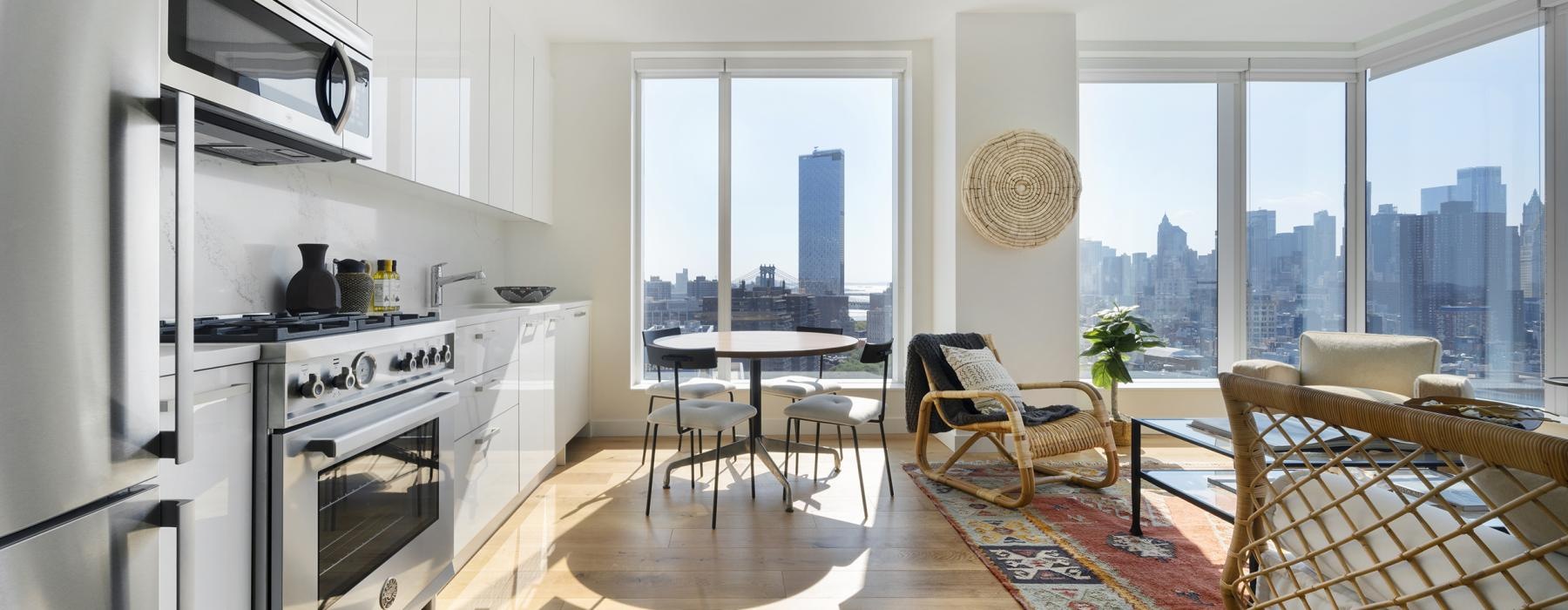 a kitchen with a table and chairs
