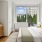 Bedroom with natural light and a door to the private patio