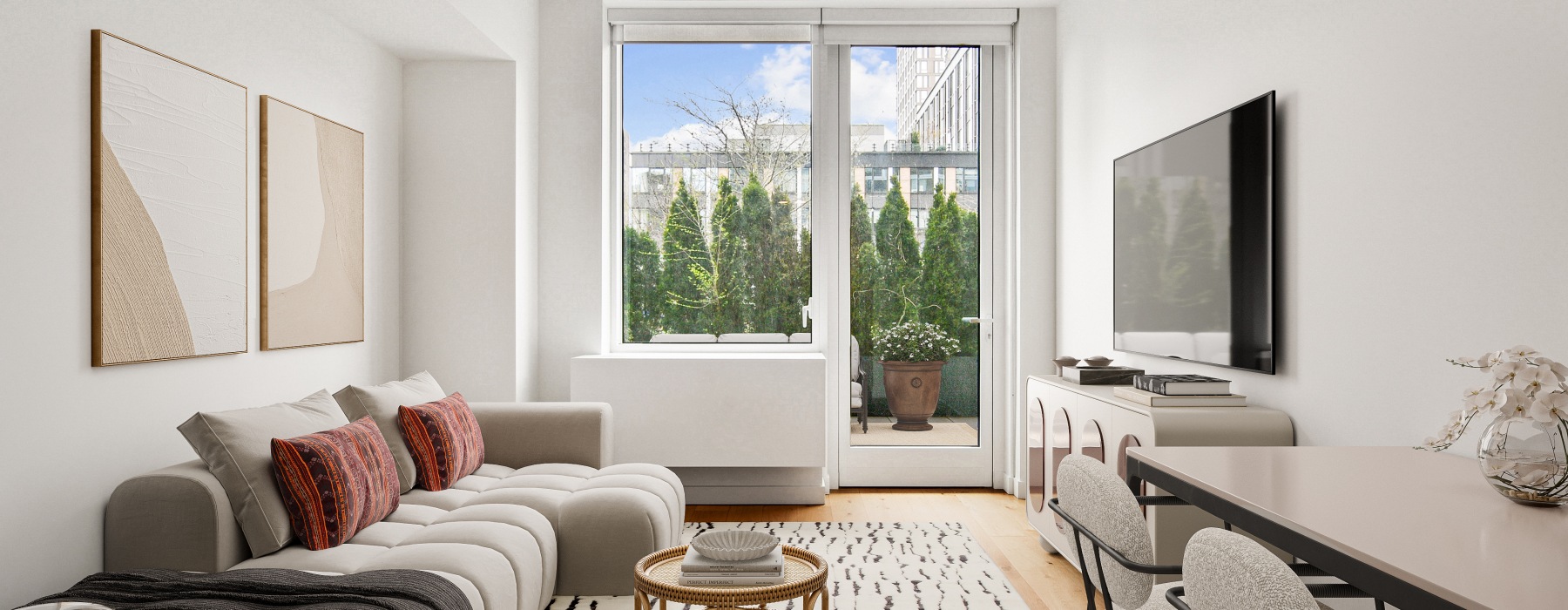 Living room with couch, small table, and dining chairs.