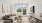 Living room with couch, small table, and dining chairs.